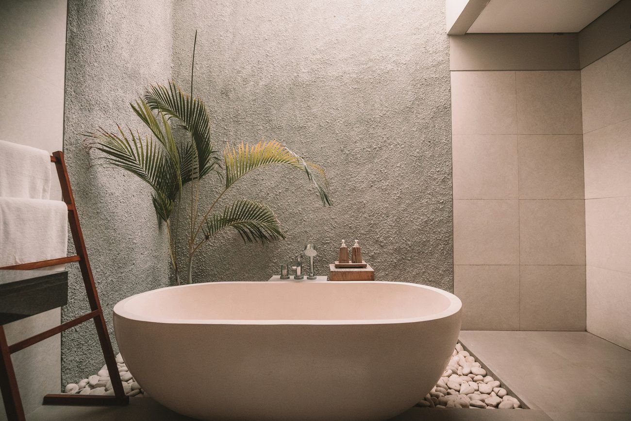 A private soaking tub in a stone walled room